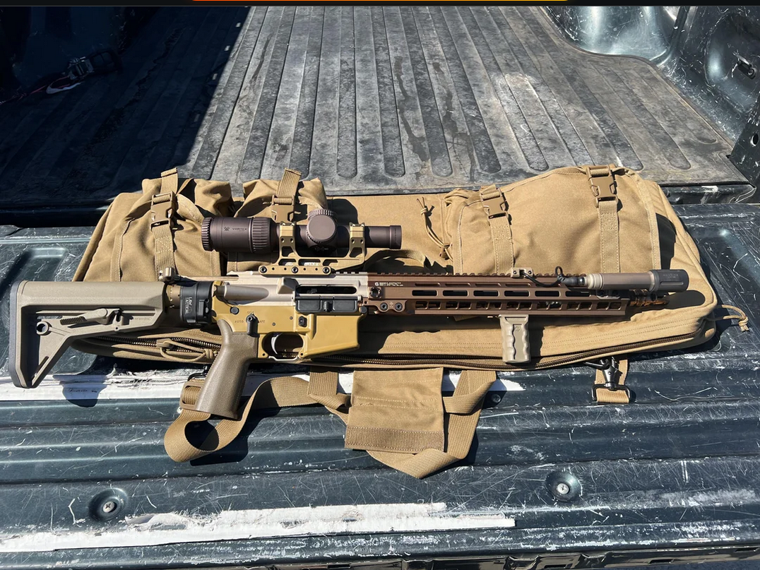 22 ARC Rifle Set Up laying on the back of a truck bed